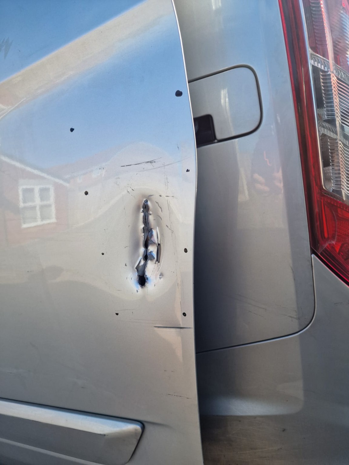 Damage to van door following attempted break-in